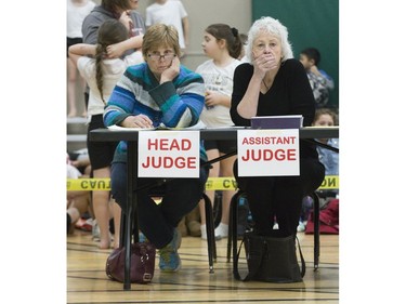 Helen Peternal (left) and Judy Harrigan assess the quality of performances during the London District Catholic school board gymnastics meet at the Carling Heights Optimist Centre in London, Ont. on Tuesday March 5, 2019. The five-day meet wrapped up on Tuesday having seen more than 2,500 participants from 45 schools. Derek Ruttan/The London Free Press/Postmedia Network
