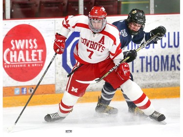 Medway's Mark Cassidy defends the puck from CCH's Jordan Daer during their WOSSAA AAA gold medal game at Joe Thornton Community Centre in St. Thomas on Tuesday March 5, 2019.  The Cowboys rode to a 2-0 win for the gold and will move on to OFSAA in Barrie. Mike Hensen/The London Free Press/Postmedia Network