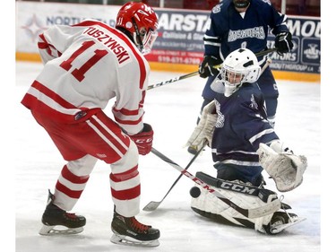 Medway's Travis Tuszynski tries to deflect a shot past CCH goalie Brennan Panziera during their WOSSAA AAA gold medal game at Joe Thornton Community Centre in St. Thomas on Tuesday March 5, 2019.  The Cowboys rode to a 2-0 win for the gold and will move on to OFSAA in Barrie. Mike Hensen/The London Free Press/Postmedia Network