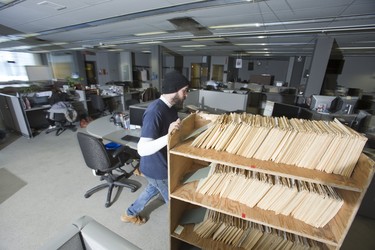 John Durston of Campbell Movers removes newspaper clipping and photograph files from the newsroom of the London Free Press in London, Ont. on Wednesday March 6, 2019. The files will are destined for the London Public Library. The London Free Press is moving from it's current location a 369 York Street to 210 Dundas Street. Derek Ruttan/The London Free Press/Postmedia Network