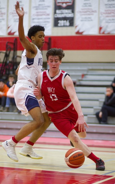 Adam Bullen, of Woodstock Collegiate secondary school, turns the corner and goes baseline on Villanova College's Jalen Thompsonn-Samuels during their consolation final in the boys A OFSAA basketball tournament. Woodstock won the consolation final, held at Fanshawe College, 57-47 with Bullen scoring the game high 23 points. Mike Hensen/The London Free Press