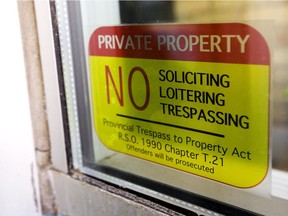 A new sticker being distributed by the Downtown London business improvement association lets police approach homeless people when they're on private property. (Mike Hensen/The London Free Press)