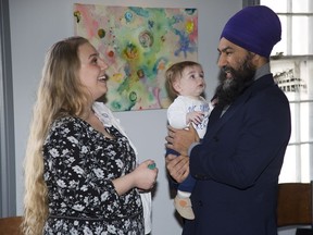 Federal NDP Leader Jagmeet Singh meets four-month-old Colton O'Brien and his mom Kitera O'Brien at the Root Cellar on Friday in London, where he spoke about affordable housing and the SNC Lavalin affair. (Derek Ruttan/The London Free Press)