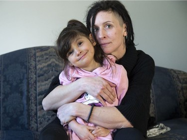 Sarah Taylor snuggles her five-year-old daughter, Zuri Clements, who is on a waiting list for in-school occupational and speech therapy. Derek Ruttan/The London Free Press