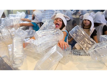 Rhiana Parada can only watch as Sophia Baljet happily demolishes their painstakingly constructed fort in the polar exhibit at the London Children's Museum pajama party held on Friday. They were attending the museum's first pajama party, the first of a long slate of activities the museum has planned to help parents out during March break. (Mike Hensen/The London Free Press)