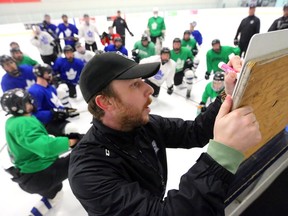 London Nationals' assistant coach Jeff Bradley lays out a strategy on a board during a practice Tuesday as the team gets ready to face the LaSalle Vipers in the second round of the GOJHL playoffs.  (Mike Hensen/The London Free Press)