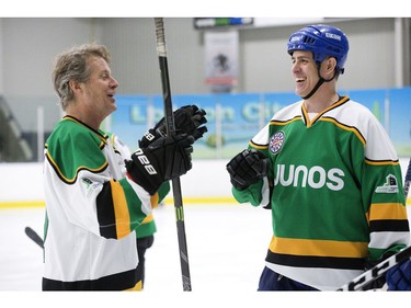 Blue Rodeo frontman Jim Cuddy, left, and former New York Islander Brad Dalgarno laugh it up during a pre-scrimmage warm-up in preparation for the Juno Cup on Thursday March 14, 2019 in London. The Juno Cup is an annual celebrity fundraising hockey game in support of MusiCounts, Canada's music education charity. The game, featuring musicians, former NHL players and members of the national women's hockey team, will take place Friday, March 15 at the Western Fair Sports Centre. (Derek Ruttan/The London Free Press)
