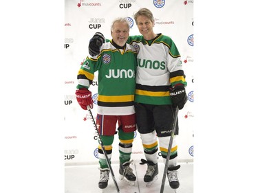 Former London Knight,  Minnesota North Star and Washington Capital Dennis Maruk  poses with Blue Rodeo frontman Jim Cuddy during a pre-scrimmage warm-up on Thursday March 14, 2019 in London in preparation for the Juno Cup. The Juno Cup is an annual celebrity fundraising hockey game in support of MusiCounts, Canada's music education charity. The game, featuring musicians, former NHL players and members of the national women's hockey team, will take place Friday, March 15 at the Western Fair Sports Centre. (Derek Ruttan/The London Free Press)