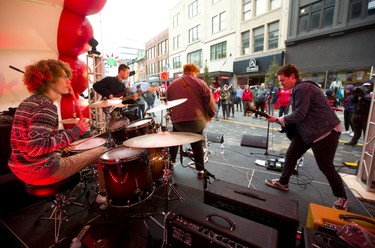 Sneaker Club, drummer Bryan Dowd, bassist Luke Van Bakel, front man Dan Wagg and guitarist John Gould, put on an energetic performance for people on Dundas Place Friday. (Mike Hensen/The London Free Press)