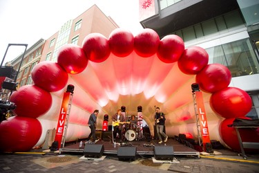 Sneaker Club starts to rock the flex street on Dundas Place in front of the new Fanshawe College buildings in downtown London o Friday.  Sneaker Club, made up of guitarist John Gould, singer Dan Wagg, drummer Bryan Dowd and bassist Luke Van Bakel, is made up of Fanshawe students.  (Mike Hensen/The London Free Press)