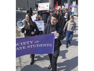Mary Blake of Western University's Society of Graduate Students leads a march of more than 100 people who participated in a protest at Western in London on Wednesday against the Ontario government's changes to its student assistance plan, which will eliminate free tuition for the neediest families and also allow students to opt out of some compulsory fees for student services and club. (Derek Ruttan/The London Free Press)