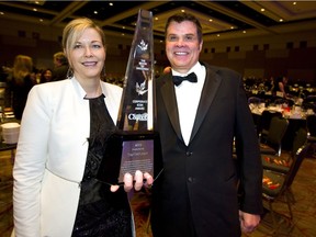 Lynn Smurthwaite-Murphy, chief executive, and Paul Seed, founder and executive chairperson of StarTech.com, hold the Business Icon award their company received at the 2019 Business Achievement Awards held at the London Convention Centre on Wednesday.  (Mike Hensen/The London Free Press)