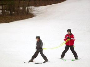 Liam Atkinson of Oxbow public school is guided down the hill at Boler Mountain on Thursday by Track 3 instructor Steve Taylor. About 80 Grade 7-8 pupils from the rural school enjoyed spring skiing conditions Thursday as the ski hill hasn't closed up shop yet, and hopes to continue past the weekend.  (Mike Hensen/The London Free Press)