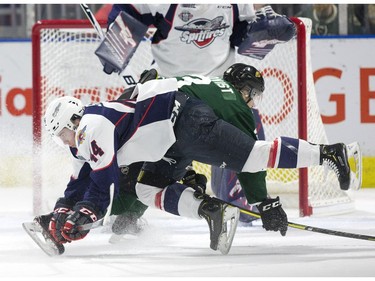 Windsor Spitfire defenceman Nathan Staios collides with London Knight Adam Boqvist during the second period of Game 2 at Budweiser Gardens in London on Sunday. (Derek Ruttan/The London Free Press)