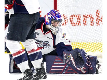 Windsor Spitfire goalie Colton Incze makes a save during the second period of Game 2 against the London Knights at Budweiser Gardens in London on Sunday.  (Derek Ruttan/The London Free Press)