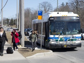 Riders get off an LTC bus at Oxford Street and Proudfoot Lane in London. Derek Ruttan/The London Free Press