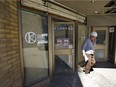 Chris Remsik walks out of a new marijuana shop under construction at 691 Richmond Street, Suite 5 along Richmond Row in London, Ont.  (Mike Hensen/The London Free Press)