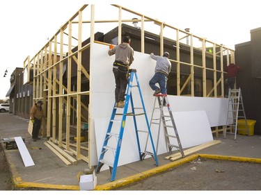 Workers scramble to erect temporary cladding around one of London's three initial marijuana shops. The store is expected to open on April 1 at 666 Wonderland Rd., just north of Oxford Street in the site of the former Oarhouse pub. Photograph taken on Wednesday March 27, 2019.  (Mike Hensen/The London Free Press)