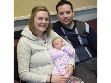 Ashlyn and Brayden Krell hold two-month old daughter Saoirse. Derek Ruttan/The London Free Press