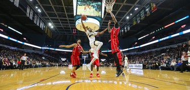 Lightning's Marcus Capers goes up is fouled by Windsor's Ty Walker but makes the hoop during their final game of the season at Budweiser Gardens in London, Ont. The game meant nothing to either team as the Lightning had clinched first in the division while Windsor is out of the playoff picture. Photograph taken on Sunday March 31, 2019.  Mike Hensen/The London Free Press/Postmedia Network