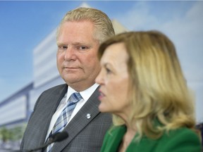 Ontario Premier Doug Ford watches as Health Minister Christine Elliott speaks at an event at The Centre for Addiction and Mental Health in Toronto on January 30, 2019.
