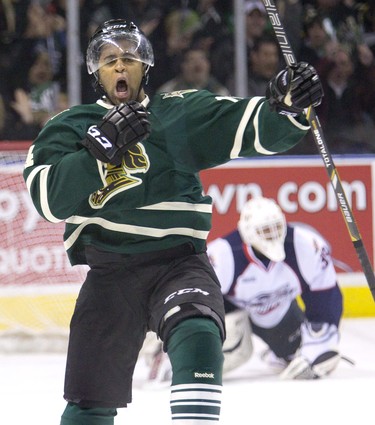 London Knight Gemel Smith celebrates after blasting a slap shot passed Windsor Spitfires goalie Alex Fotinos  during OHL action in London, Ont. on Friday, March 21, 2014. DEREK RUTTAN/ The London Free Press /QMI AGENCY