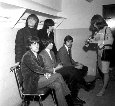The Rolling Stones backstage at what became an infamous concert in London on April 27, 1965. That's a (very) young Mick Jagger glancing sideways toward a Free Press photographer's camera. (Western Archives, The London Free Press)