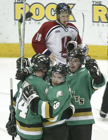 London Knights Corey Perry, (left to right) Dylan Hunter and Dan Fritsche celebrate their third goal during OHL playoff action against the Windsor Spitfires in Windsor, Ont. on Thursday April 7, 2005. (Windsor Star-Dan Janisse)