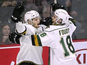 William Lochead, left, and Liam Foudy of the London Knights celebrate a first period goal against the Windsor Spitfires on Thursday, March 28, 2019 at the WFCU Centre in Windsor, ON. during game 4 of their playoff series. (DAN JANISSE/The Windsor Star)