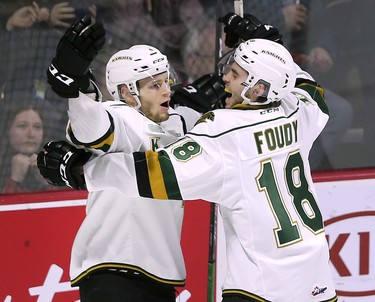 William Lochead, left, and Liam Foudy of the London Knights celebrate a first period goal against the Windsor Spitfires on Thursday, March 28, 2019 at the WFCU Centre in Windsor, ON. during game 4 of their playoff series. (DAN JANISSE/The Windsor Star)