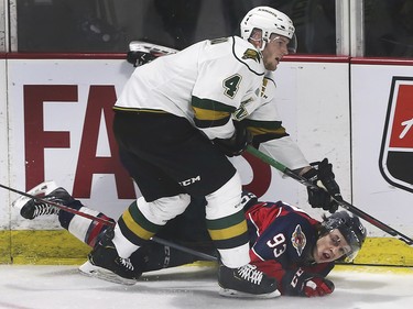 William Lochead, left, of the London Knights collides with Jean-Luc Foudy of the Windsor Spitfires during game 4 of their playoff series on Thursday, March 28, 2019 at the WFCU Centre in Windsor, ON. (DAN JANISSE/The Windsor Star)