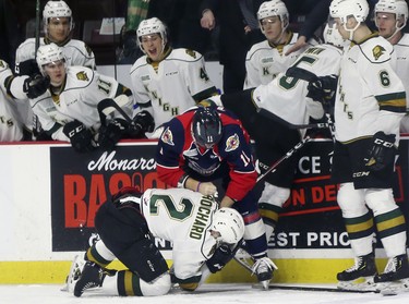 Sean Allen of the Windsor Spitfires roughs up Avan Bouchard of the London Knights during game 3 of their playoff series at the WFCU Centre in Windsor, ON.  (DAN JANISSE/The Windsor Star)