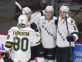 Alex Formenton, left, Kevin Hancock, Adam Boqvist and Evan Bouchard celebrate (DAN JANISSE/The Windsor Star)