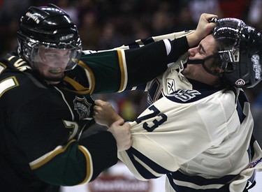 Windsor Spitfire Michael Whaley (R) and London Knight Dane Fox fight Nov. 10, 2010, at the WFCU Centre in Windsor, ON.