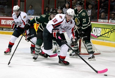 Windsor Spitfires forward Kerby Rychel protects the puck from London Knights defenceman Olli Maatta at the WFCU Centre in Windsor Thursday, Nov. 1, 2012. The Spitfires rallied back from a two goal deficit to beat the Knights 6-3.  JOEL BOYCE/QMI AGENCY