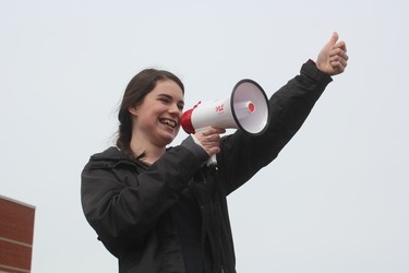 Grade 11 student Louisa Flock leads the protest to changes to education at St. Joseph’s secondary school. Flock was among about 100 students at the school who walked out of class Thursday.