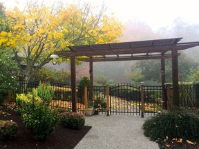 A pergola is used here to enhance a front entry. Many such structures are being upgraded with lighting and retractable shades to cover outdoor entertainment areas.