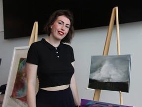 Artist Angie Quick stands next to a painting she donated to this years UPwithART event, a fundraiser for the local shelter Unity Project. JONATHAN JUHA/THE LONDON FREE PRESS