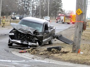 Fire officials are seen at the scene of a collision last Wednesday at Frances Street and St. George Street (Highway 23), in Mitchell. One of the passenger of the pickup truck has died of her injuries, police said. (ANDY BADER/Postmedia News)