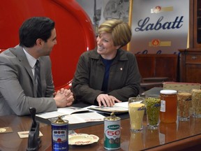 MPs Peter Fragiskatos and Karen Vecchio examine ingredients before brewing a honey wheat beer at Labatt in London. It will be their bipartisan entry in Election Brew 2019. A national winner will be chosen May 29 in Ottawa. (Wayne Newton photo)