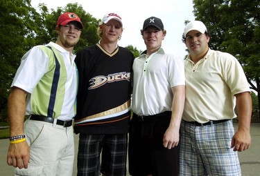 Former London Knight and Stanley Cup winner Corey Perry of the Anaheim Ducks, second from left, poses with former Knights teammates Brandon Prust, left, Danny Syvret, second from right, and Kelly Thomson in 2007.