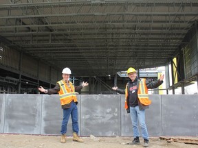 Ward 1 Coun. Michael van Holst and Ward 2 Coun. Shawn Lewis show off the construction at the East London Community Centre, set to open this fall. The facility at East Lion's Park, which includes a gym, pool, community lounge, kitchen and exercise and meeting rooms, is fully roughed in and windows are now being added. (MEGAN STACEY/The London Free Press)