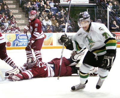 Scott Kosmachuk of the Guelph Storm scores against Jake Patterson of  News Photo - Getty Images
