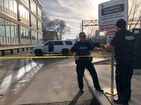 London police are investigating after a body was found in a vehicle behind a business adjacent to the Greyhound bus station in downtown London on the morning of Wednesday April 17, 2019. The white SUV in this photograph is a London police vehicle. (Jonathan Juha/The London Free Press)
