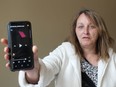 Lee Bolton displays a video she took on her phone after a driver of a medical patient transportation van was pulled over by OPP after she called to report he was driving while using a tablet on Saturday. (Ellwood Shreve/Chatham Daily News)