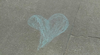 A heart drawn in chalk as part of a protest against London’s abusive street-preacher duo.