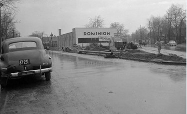 The third Dominion store in London will soon be opened on Hamilton Road. The new market is designed to offer additional shopping service in a district which has need for such a food centre. It is a one floor store, 42 X 117 feet, and will feature fluorescent lighting, wide aisles for shopping convenience, with specially designed shelves. Special refrigeration units give complete protection to perishables. The new Dominion store will have a 20 foot meat counter across the back of the store."
The signs out front read: Another New Dominion Master Market with Free Parking. New Dominion Stores Building, Riddle & Connor Architects, McKay-Cocker General Contractors.
This image is looking westerly from the 'V' of Trafalgar and Hamilton Road west of Egerton Street. March 25, 1950 (Western University Archives, LFP Negative Collection)