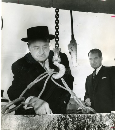 Col. D.B. Weldon capped the cornerstone of the $8,430,000 dental sciences building at the University of Western Ontario as his last official function as chairman of the board of governors, looking on is dental dean Wesley J. Dunn, 1967. (London Free Press files)