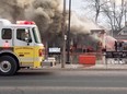 Firefighters from three stations battle a blaze Sunday morning that destroyed Hog Town Cycles in Lucan. The Ontario Fire Marshals Office is investigating the blaze that caused hundreds of thousands of dollars in damage. No one was injured.