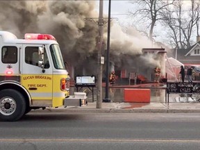 Firefighters from three stations battle a blaze Sunday morning that destroyed Hog Town Cycles in Lucan. The Ontario Fire Marshals Office is investigating the blaze that caused hundreds of thousands of dollars in damage. No one was injured.